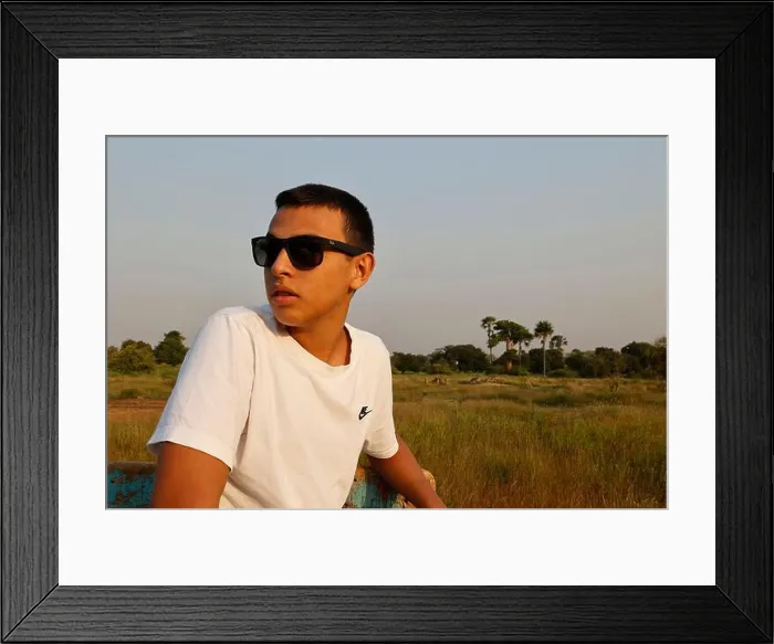 Framed Print : Young man wearing sunglasses traveling in Senegal Framed Print : Young man wearing sunglasses traveling in Senegal