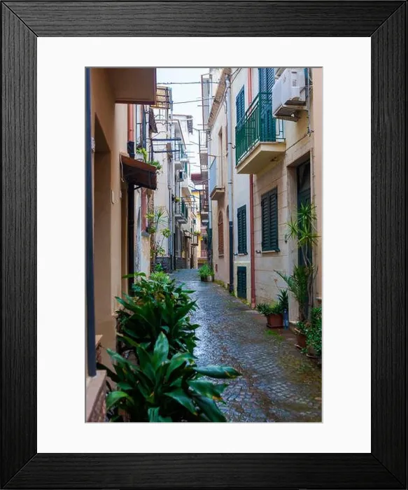 Framed Print : Vico Raffaele Piria, a pretty cobbled lane in Scilla, Calabria, southern Italy, on an unseasonably wet morning Framed Print : Vico Raffaele Piria, a pretty cobbled lane in Scilla, Calabria, southern Italy, on an unseasonably wet morning