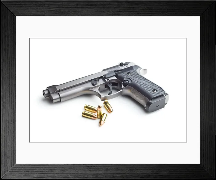 Framed Print : 9mm pistol bullets and handgun isolated on white background Framed Print : 9mm pistol bullets and handgun isolated on white background