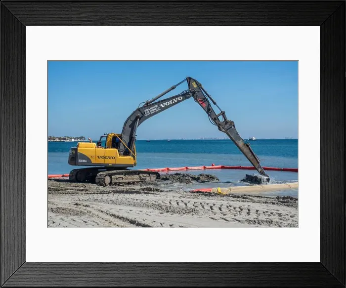 Framed Print : Digger escavates sand form the Mar Menor in Los Alcazares in Murcia Framed Print : Digger escavates sand form the Mar Menor in Los Alcazares in Murcia