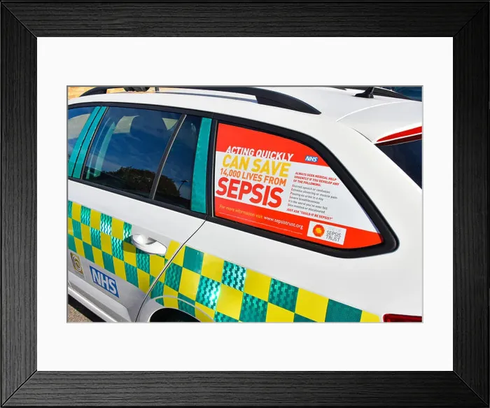 Framed Print : Healthcare awareness poster advert promotion saving lives from Sepsis NHS doctors car window in National Health service Framed Print : Healthcare awareness poster advert promotion saving lives from Sepsis NHS doctors car window in National Health service