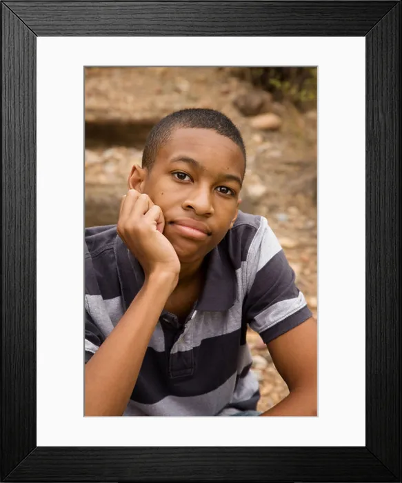 Framed Print : Handsome African-American Male sitting in an outdoor setting Framed Print : Handsome African-American Male sitting in an outdoor setting