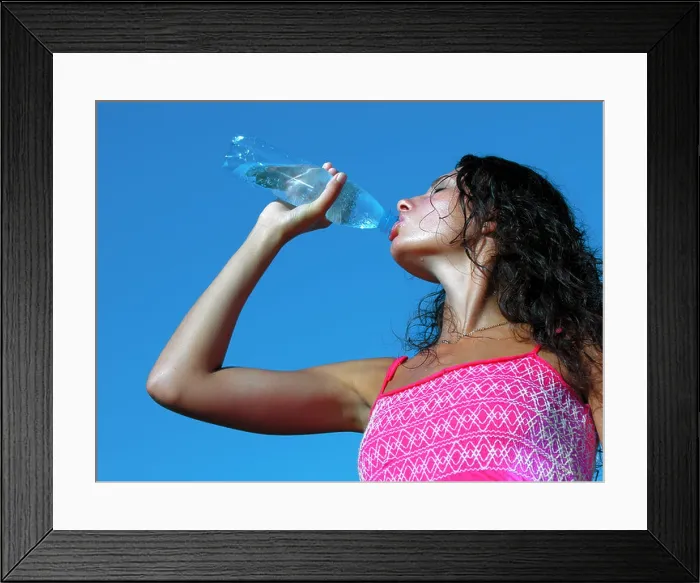 Framed Print : Thirst. Young woman drinking cold water in hot day Framed Print : Thirst. Young woman drinking cold water in hot day