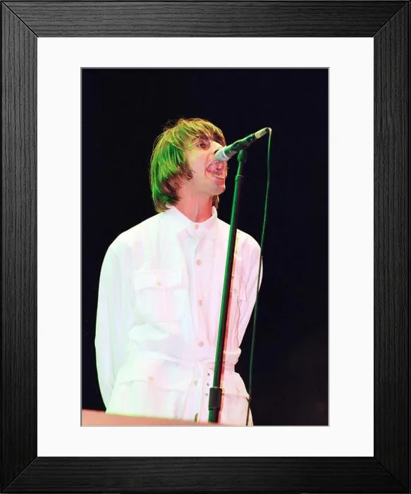 Framed Print : Liam Gallagher performing live onstage with Oasis on the first night at Knebworth, August 1996 Framed Print : Liam Gallagher performing live onstage with Oasis on the first night at Knebworth, August 1996