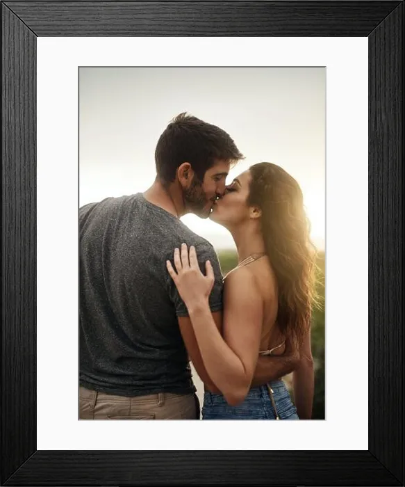 Framed Print : Kiss me and youll see how much I love you. Rearview shot of a young couple kissing at the beach Framed Print : Kiss me and youll see how much I love you. Rearview shot of a young couple kissing at the beach