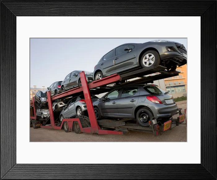 Framed Print : Automobile transport truck carrying new cars to be delivered Framed Print : Automobile transport truck carrying new cars to be delivered