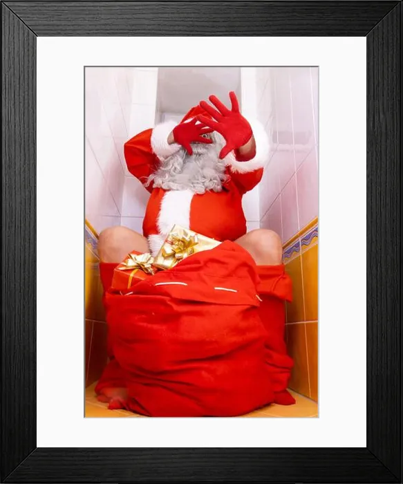 Framed Print : Santa Claus is surprised from the paparazzi photographer when sitting on the toilet Framed Print : Santa Claus is surprised from the paparazzi photographer when sitting on the toilet