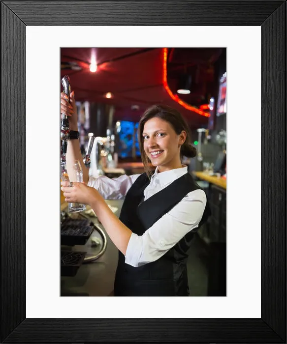 Framed Print : Happy barmaid pulling a pint of beer Framed Print : Happy barmaid pulling a pint of beer