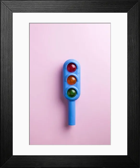 Framed Print : Toy traffic light close-up on a colored background. Art concept of road traffic, accidents, traffic rules. Copy space Framed Print : Toy traffic light close-up on a colored background. Art concept of road traffic, accidents, traffic rules. Copy space