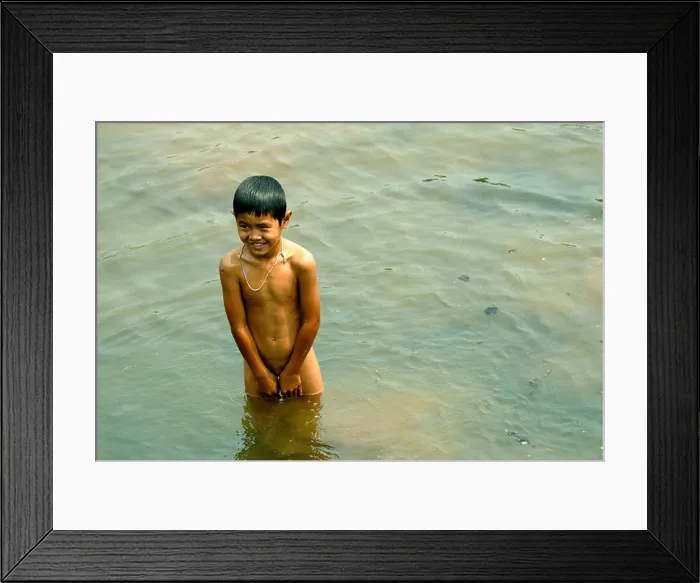 Framed Print : Boy cooling off in the Mae chem river on a very hot day on 13 / 03 / 2009 in chiang mai Thailand Framed Print : Boy cooling off in the Mae chem river on a very hot day on 13 / 03 / 2009 in chiang mai Thailand