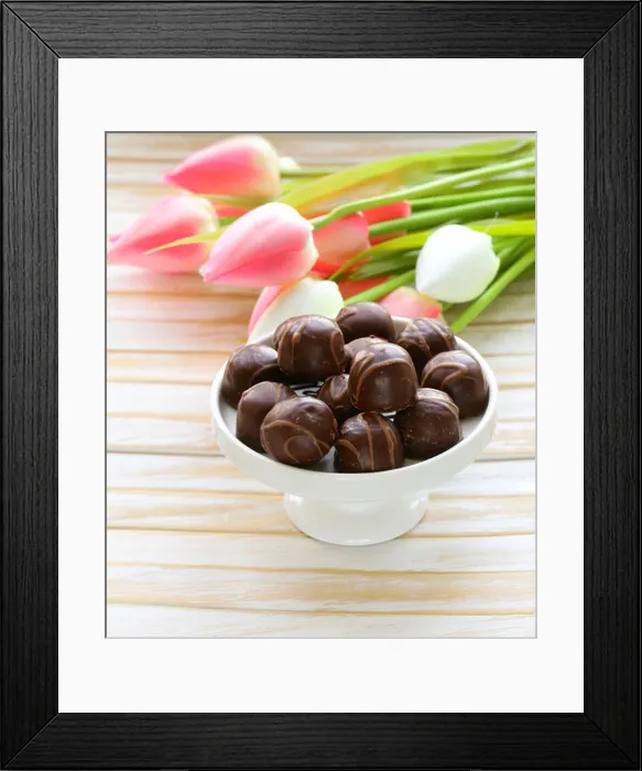 Framed Print : chocolate candy and flowers on white background Framed Print : chocolate candy and flowers on white background