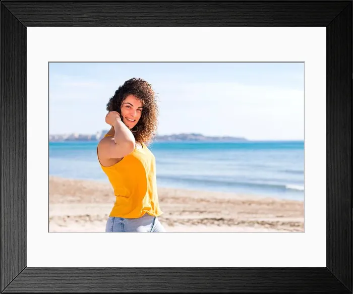 Framed Print : Happy young curly haired female in yellow top smiling Framed Print : Happy young curly haired female in yellow top smiling