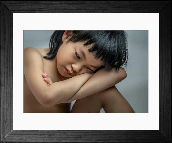 Framed Print : Portrait of poor despair little child girl, sitting without clothes, bruised on body, close up shot to emotional face Framed Print : Portrait of poor despair little child girl, sitting without clothes, bruised on body, close up shot to emotional face