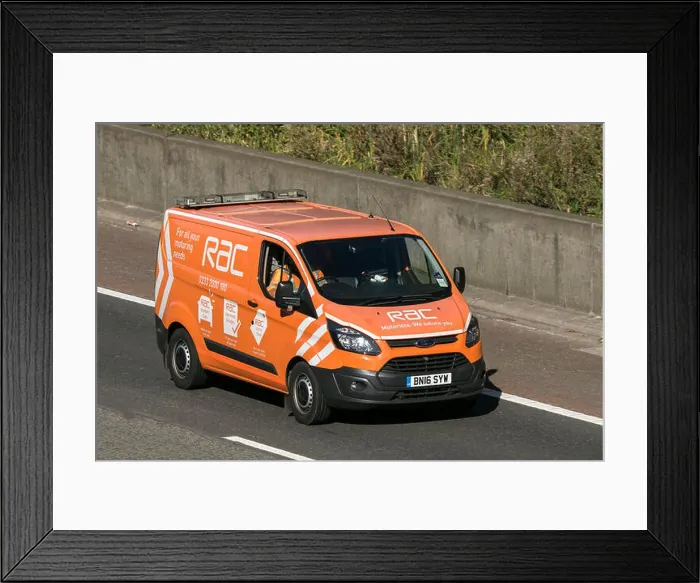 Framed Print : A Ford Transit RAC vehicle breakdown recovery truck traveling northbound on the M6 motorway near Garstang in Lancashire Framed Print : A Ford Transit RAC vehicle breakdown recovery truck traveling northbound on the M6 motorway near Garstang in Lancashire