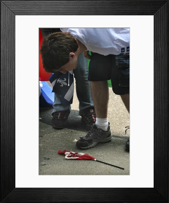 Framed Print : A young Quebec separatist spits on the Canadian flag Framed Print : A young Quebec separatist spits on the Canadian flag