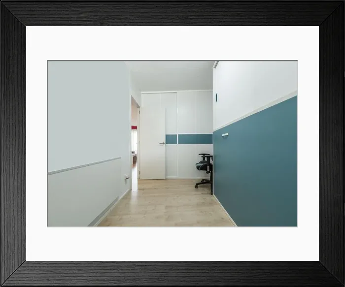 Framed Print : Youth bedroom with folding bed and desk in its folded position and built-in wardrobe with matching colors Framed Print : Youth bedroom with folding bed and desk in its folded position and built-in wardrobe with matching colors