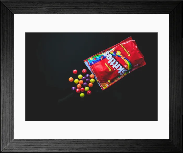 Framed Print : Colorful candy Skittles on the black background taken from the top Framed Print : Colorful candy Skittles on the black background taken from the top