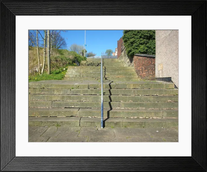 Framed Print : The 24 steps in Middleton, Greater Manchester, as depicted in L.S Lowry's painting 'The old church and steps' Framed Print : The 24 steps in Middleton, Greater Manchester, as depicted in L.S Lowry's painting 'The old church and steps'