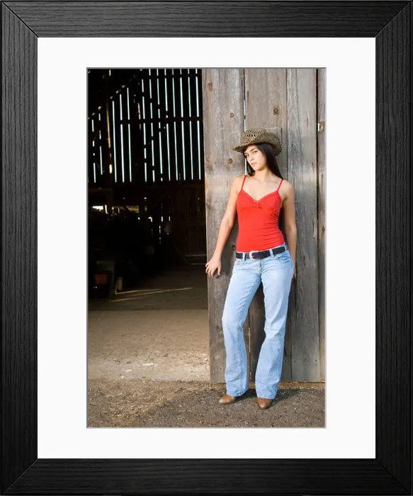 Framed Print : Cowgirl in barn doorway with hat and tank top Framed Print : Cowgirl in barn doorway with hat and tank top