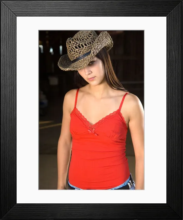 Framed Print : Cowgirl in barn doorway with hat and tank top Framed Print : Cowgirl in barn doorway with hat and tank top