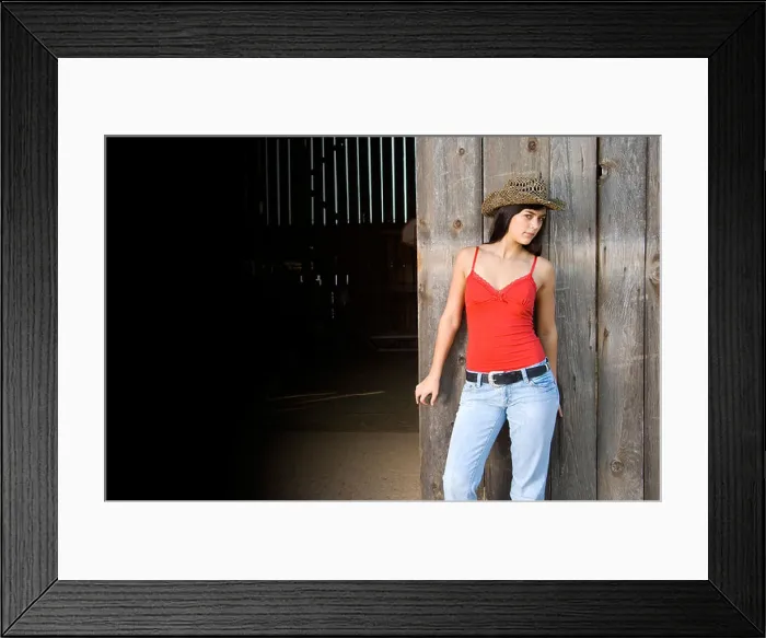 Framed Print : Cowgirl in barn doorway with hat and tank top Framed Print : Cowgirl in barn doorway with hat and tank top