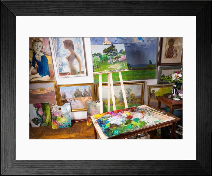 Framed Print : Interior of a professional artists studio or gallery with colorful canvases covering a variety of subjects hanging Framed Print : Interior of a professional artists studio or gallery with colorful canvases covering a variety of subjects hanging