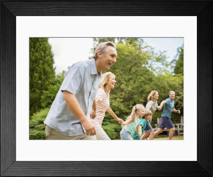 Framed Print : Multi-generation family holding hands and running Framed Print : Multi-generation family holding hands and running