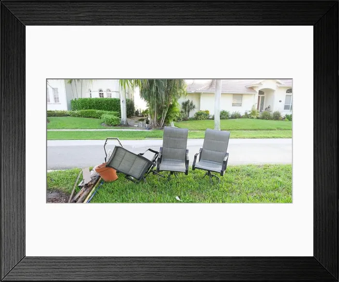 Framed Print : Bulk trash including discarded chairs at curbside for garbage collection Framed Print : Bulk trash including discarded chairs at curbside for garbage collection
