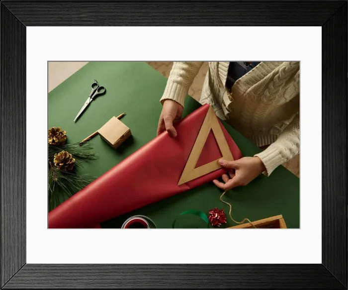 Framed Print : Top view woman's hand using wooden ruler, measuring amount of red wrapping paper for packing Christmas gifts. Boxing Day Framed Print : Top view woman's hand using wooden ruler, measuring amount of red wrapping paper for packing Christmas gifts. Boxing Day