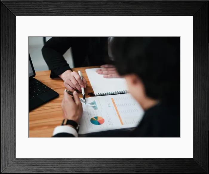 Framed Print : Diverse businesspeople discuss financial report in charts diagrams and graphs close up Framed Print : Diverse businesspeople discuss financial report in charts diagrams and graphs close up