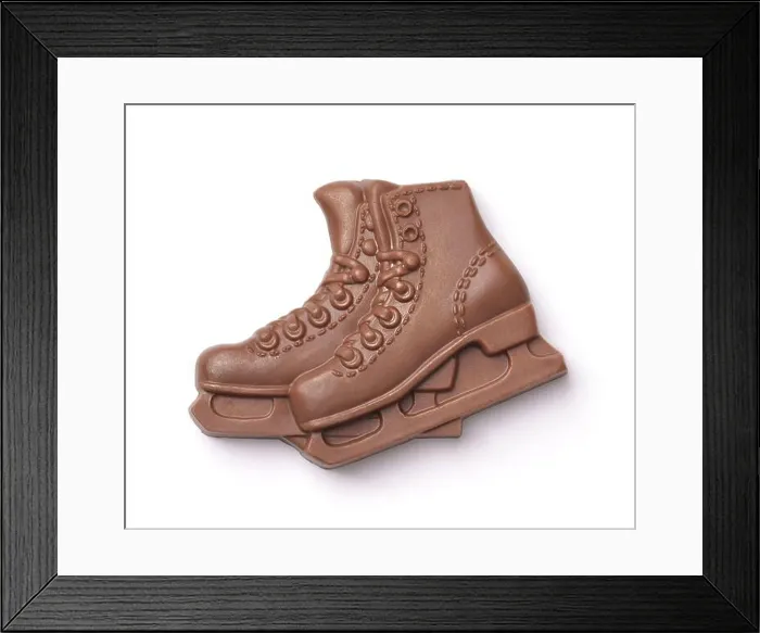 Framed Print : Top view of chocolate ice skates isolated on white Framed Print : Top view of chocolate ice skates isolated on white