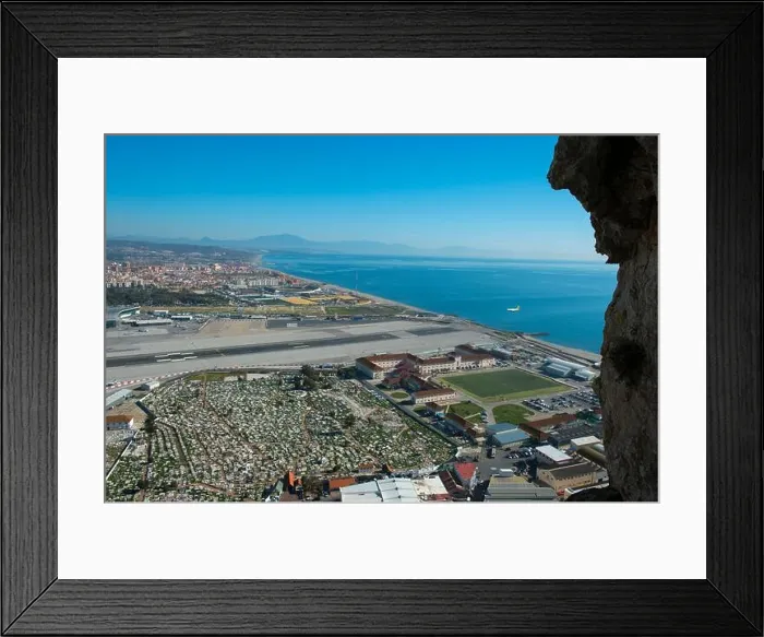 Framed Print : View of the airport with a plane landing and Spain from the World War II tunnels inside of the Rock of Gibraltar Framed Print : View of the airport with a plane landing and Spain from the World War II tunnels inside of the Rock of Gibraltar