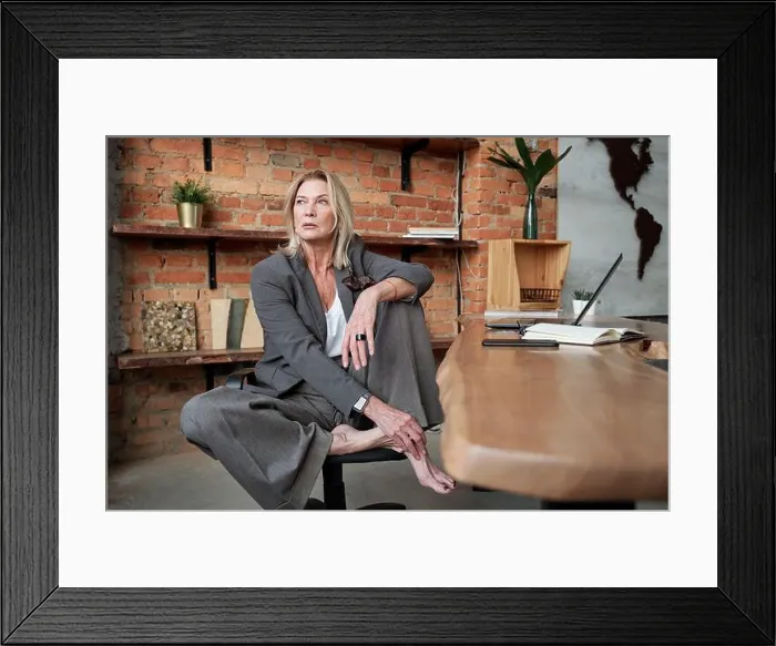 Framed Print : Barefoot businesswoman in office Framed Print : Barefoot businesswoman in office