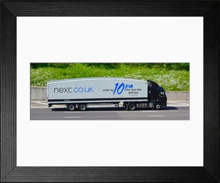 Framed Print : Next store curved streamlined articulated lorry truck Framed Print : Next store curved streamlined articulated lorry truck