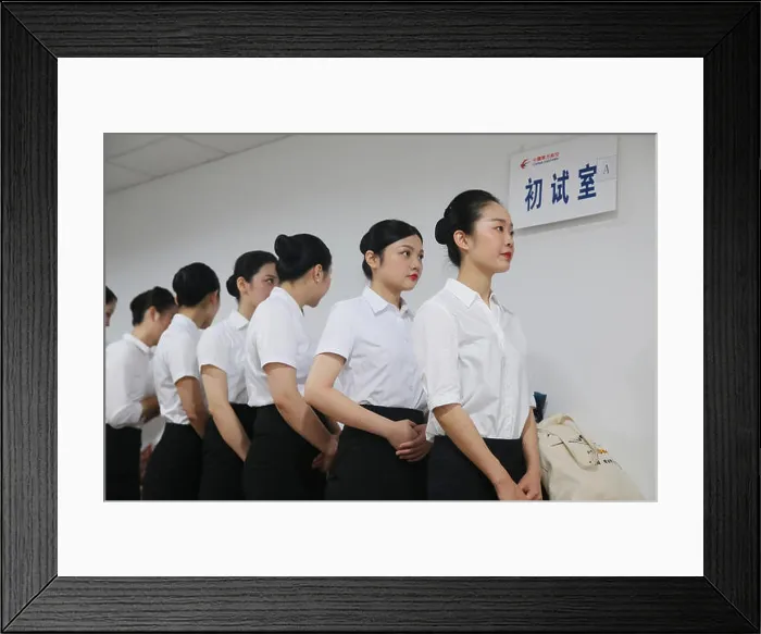 Framed Print : Applicants for China Eastern Airlines prepare to take part in an interview for flight attendant Framed Print : Applicants for China Eastern Airlines prepare to take part in an interview for flight attendant