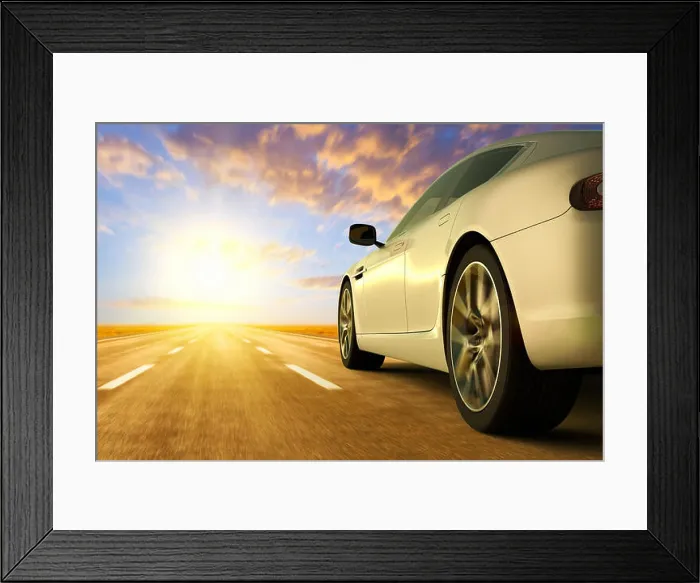 Framed Print : 3D rendering of a low angle view of car on motion on the road Framed Print : 3D rendering of a low angle view of car on motion on the road