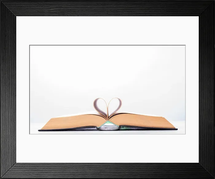 Framed Print : Valentine's day or reading concept with heart shaped book on white background Framed Print : Valentine's day or reading concept with heart shaped book on white background