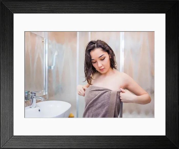 Framed Print : Beautiful brunette woman after a shower in the bathroom Framed Print : Beautiful brunette woman after a shower in the bathroom
