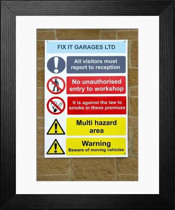 Framed Print : A Health and Safety sign outside a garage workshop Framed Print : A Health and Safety sign outside a garage workshop