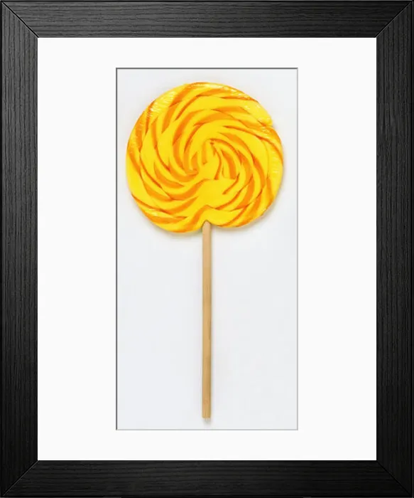Framed Print : Orange and yellow swirl lollipop, close up Framed Print : Orange and yellow swirl lollipop, close up