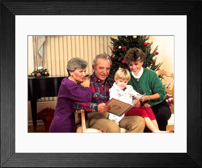 Framed Print : Affluent three generation family enjoys the gift giving spirit of the Christmas season Framed Print : Affluent three generation family enjoys the gift giving spirit of the Christmas season