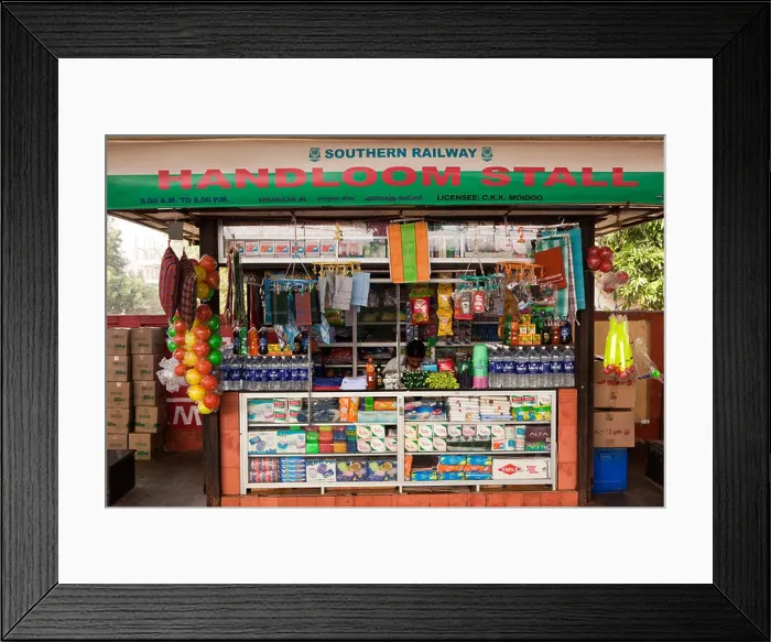 Framed Print : India, Kerala, Kochi, Ernakulam Railway Station platform, Handloom vendors stall displaying goods Framed Print : India, Kerala, Kochi, Ernakulam Railway Station platform, Handloom vendors stall displaying goods