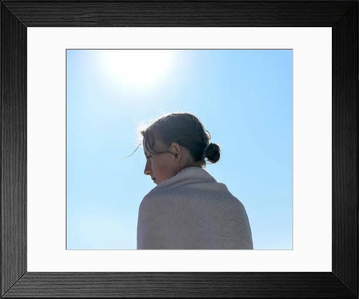 Framed Print : Profile of girl at backlight wrapped in a towel Framed Print : Profile of girl at backlight wrapped in a towel