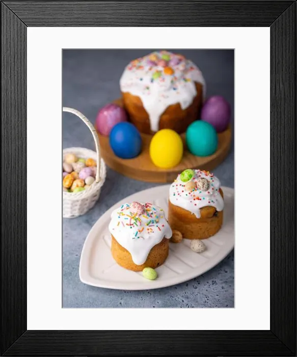 Framed Print : Two small Easter kulichs with candied fruits in white glaze with colorful sprinkles in the cut Framed Print : Two small Easter kulichs with candied fruits in white glaze with colorful sprinkles in the cut