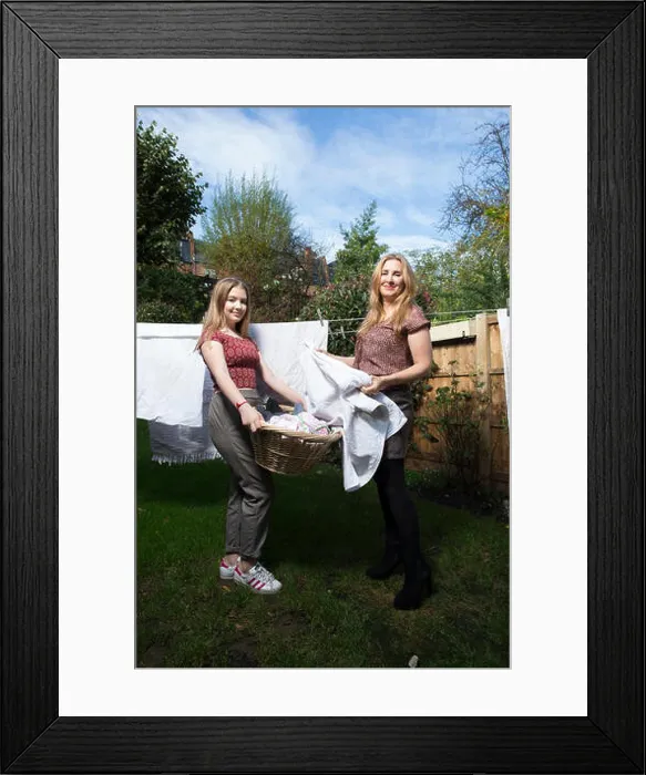 Framed Print : Married couple sharing domestic chores at home, England, UK Framed Print : Married couple sharing domestic chores at home, England, UK