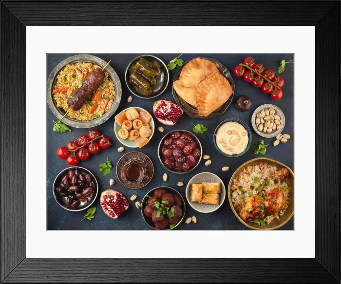 Framed Print : Ramadan kareem Iftar party table with assorted festive traditional Arab dishes Framed Print : Ramadan kareem Iftar party table with assorted festive traditional Arab dishes