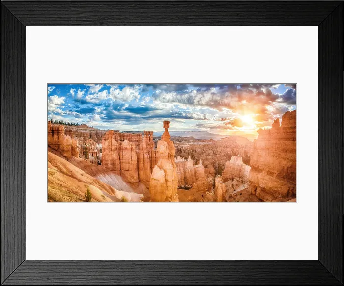 Framed Print : Amazing hoodoos sandstone formations in Bryce Canyon National Park in golden morning light at sunrise with dramatic Framed Print : Amazing hoodoos sandstone formations in Bryce Canyon National Park in golden morning light at sunrise with dramatic