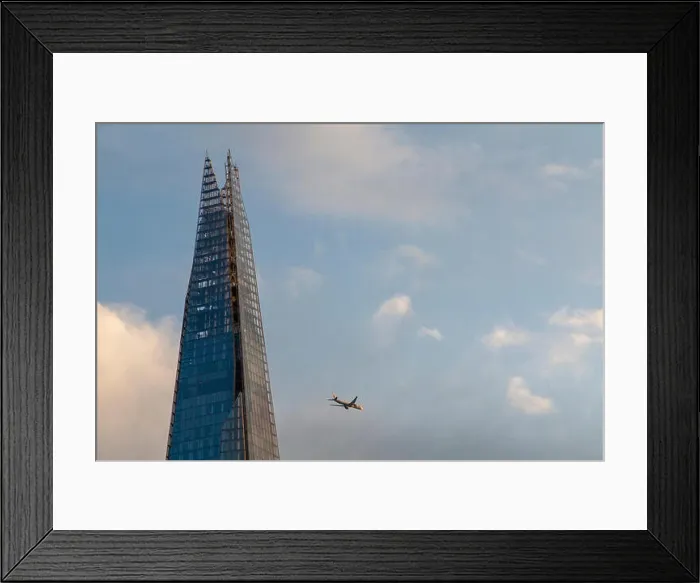 Framed Print : An aeroplane flies past the Shard on a sunny evening Framed Print : An aeroplane flies past the Shard on a sunny evening