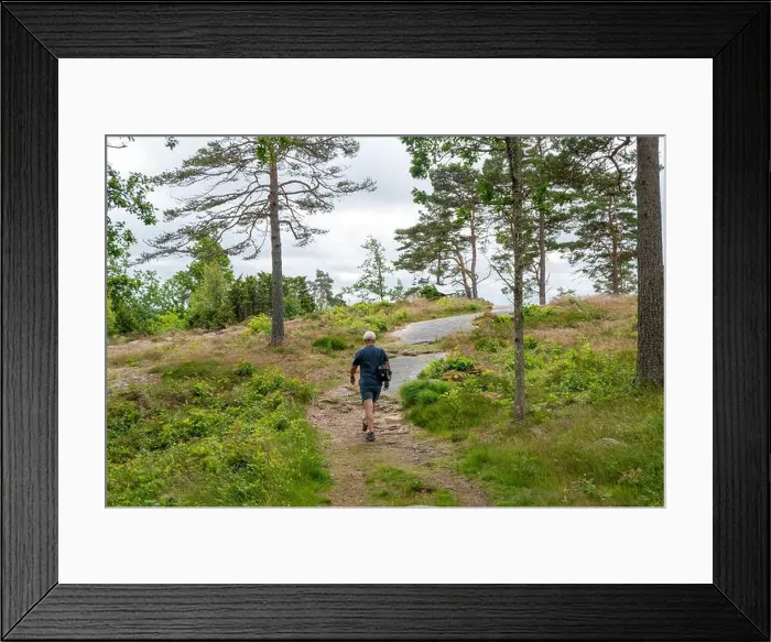 Framed Print : tourist at famous 3000 years old Rock Carvings at Tanum World Heritage Site in Vitlycke, Sweden Framed Print : tourist at famous 3000 years old Rock Carvings at Tanum World Heritage Site in Vitlycke, Sweden