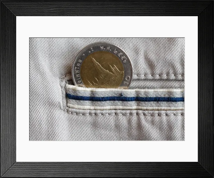 Framed Print : Thai coin with a denomination of 10 baht in the pocket of beige denim jeans with blue stripe Framed Print : Thai coin with a denomination of 10 baht in the pocket of beige denim jeans with blue stripe